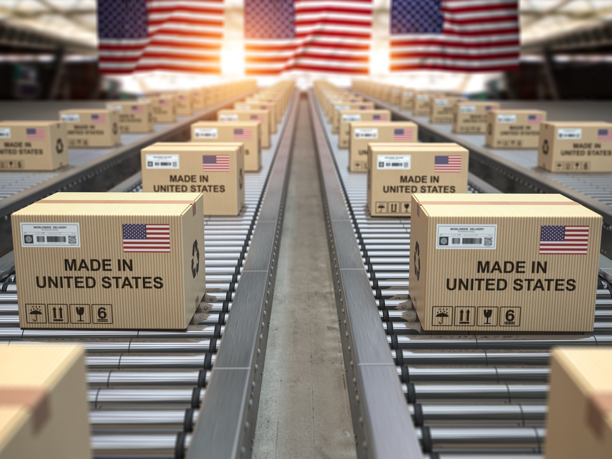 Conveyor belt carrying boxes labeled “Made in the USA,” representing American manufacturing costs rising under tariffs.