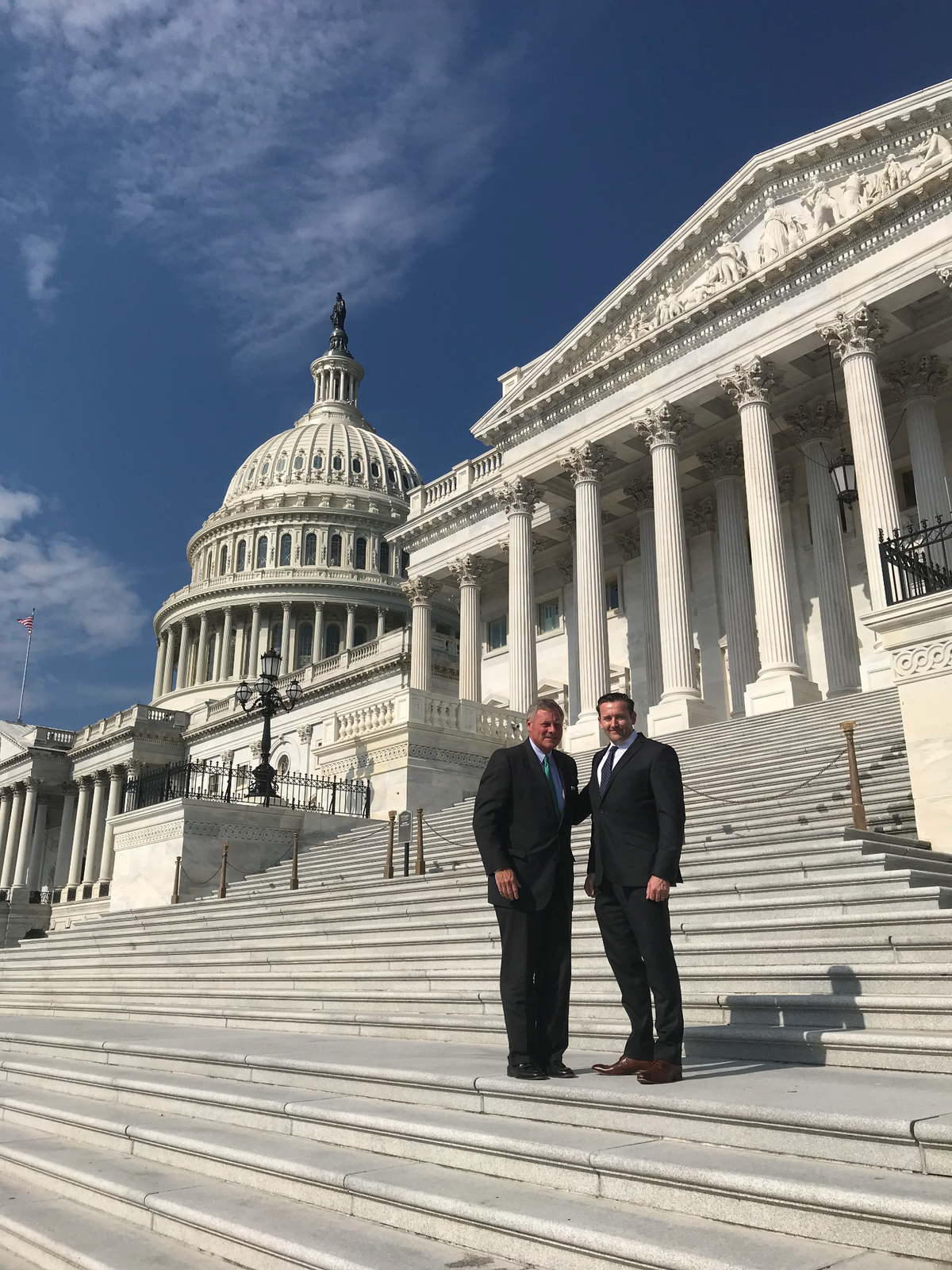 Sean Brownlee with another person on the steps of the U.S. Capitol
